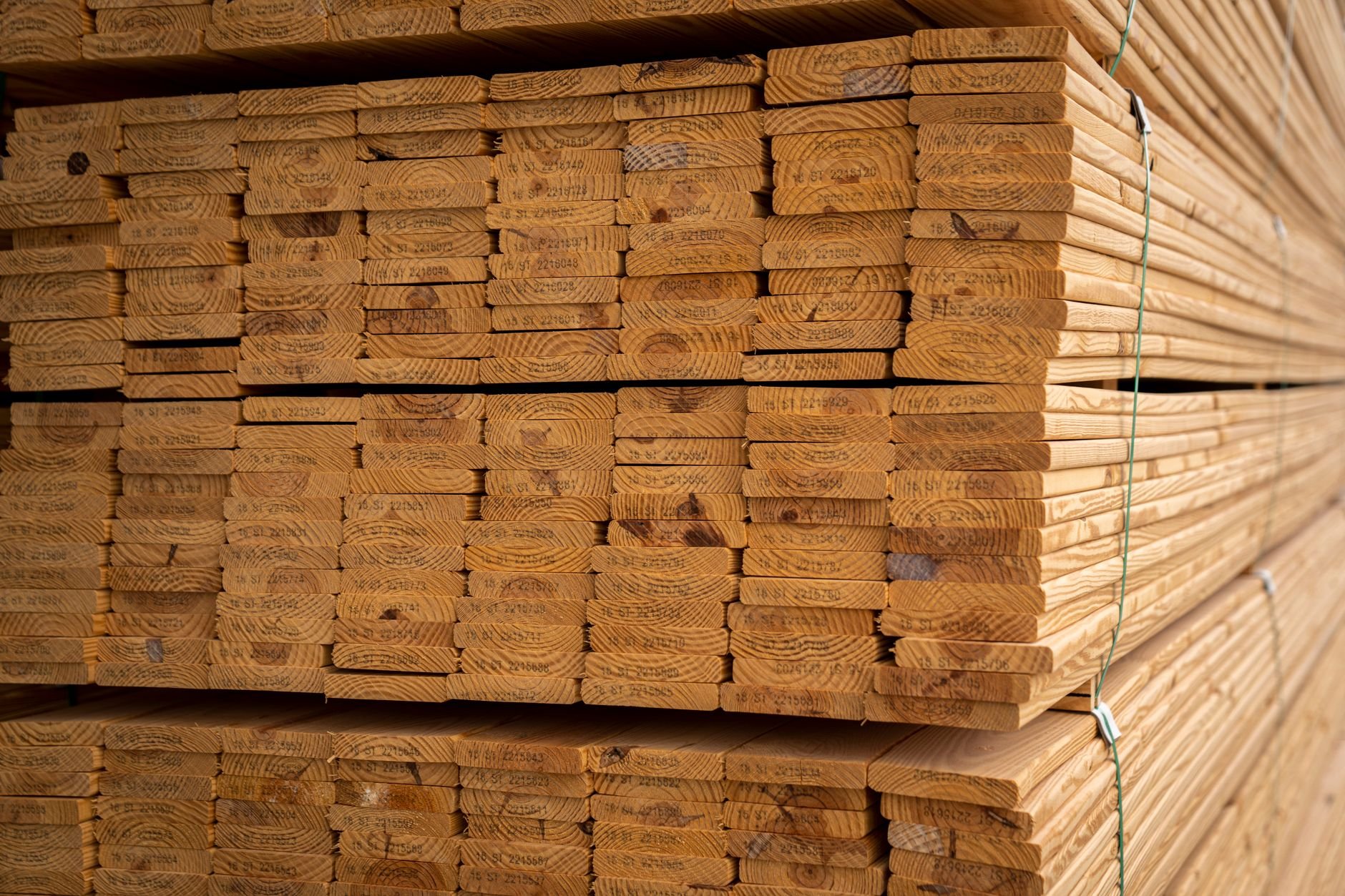 Close-up of stacked wooden flooring planks showing natural wood textures